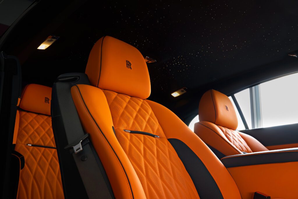 Rolls-Royce upholstery in Cyprus — bespoke Ghost orange and black leather interior